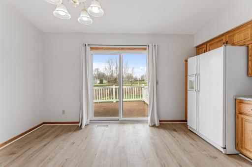 Sunny dining area, walks out to the deck.