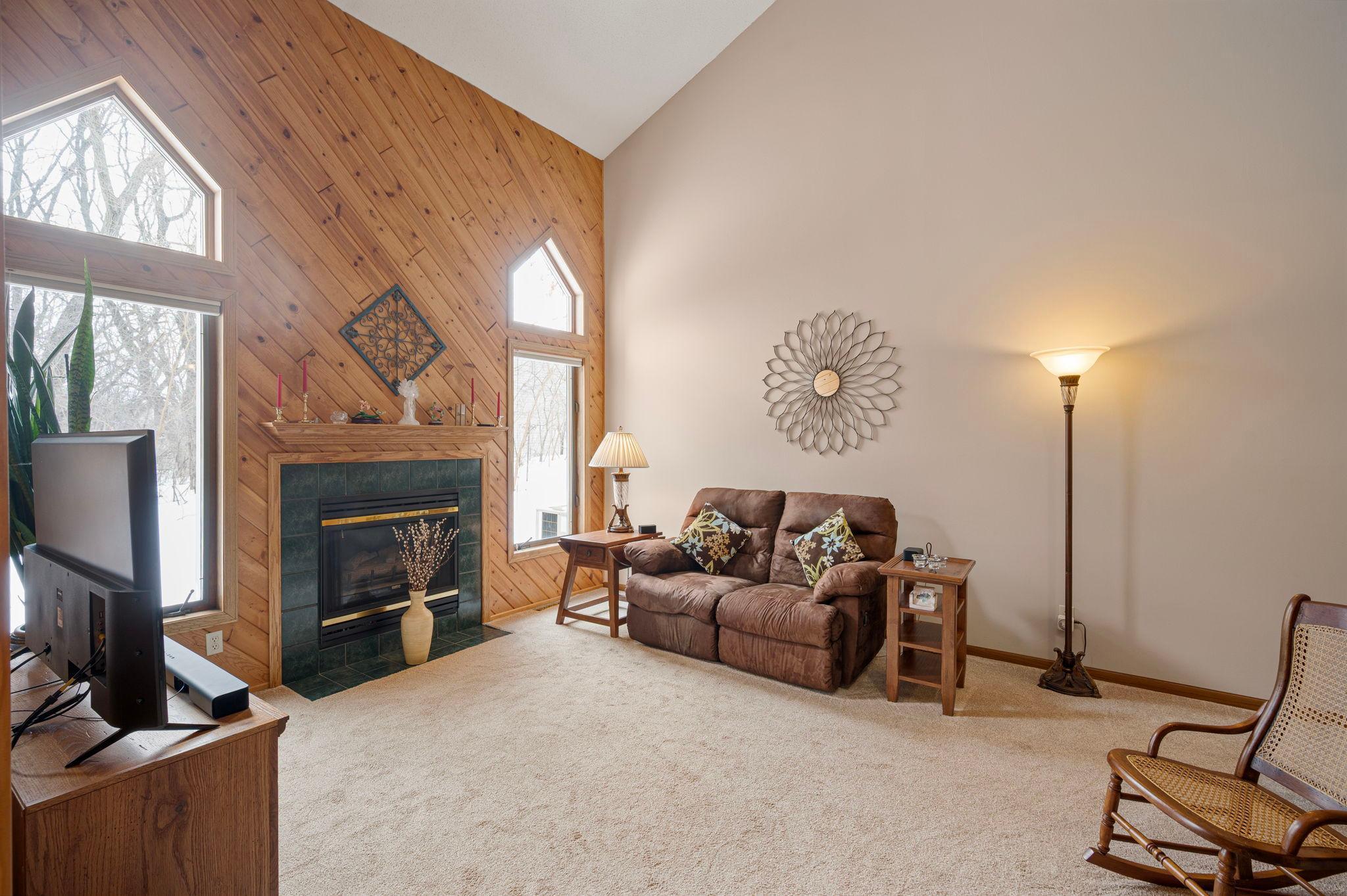 Enjoy the view of your private back yard with large windows that bring in the bright sun. Enjoy the gas fireplace in the cooler weather.