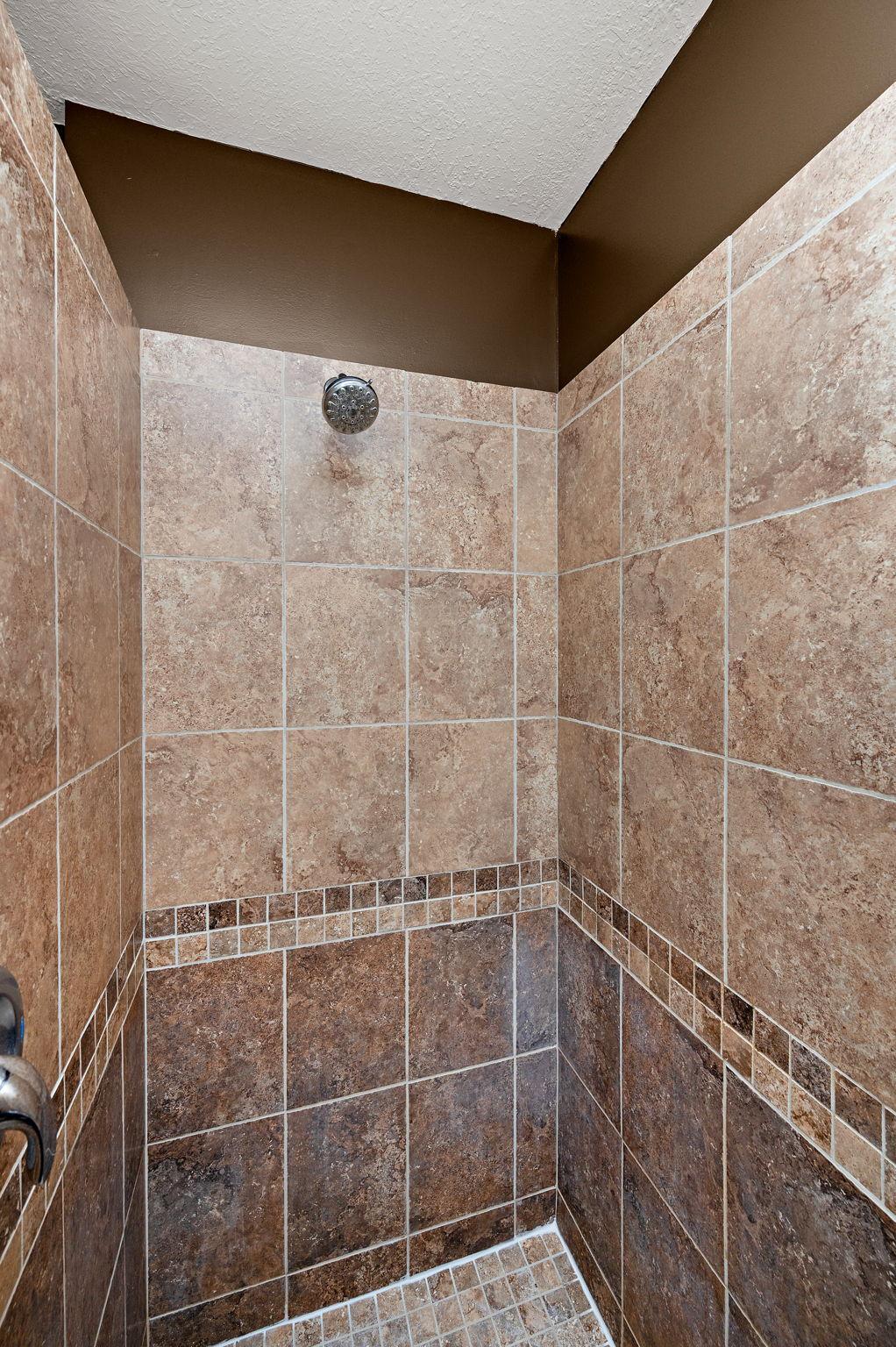 Guests will appreciate the 3/4 bath, which features tile flooring, double sinks, and a beautiful walk-in shower