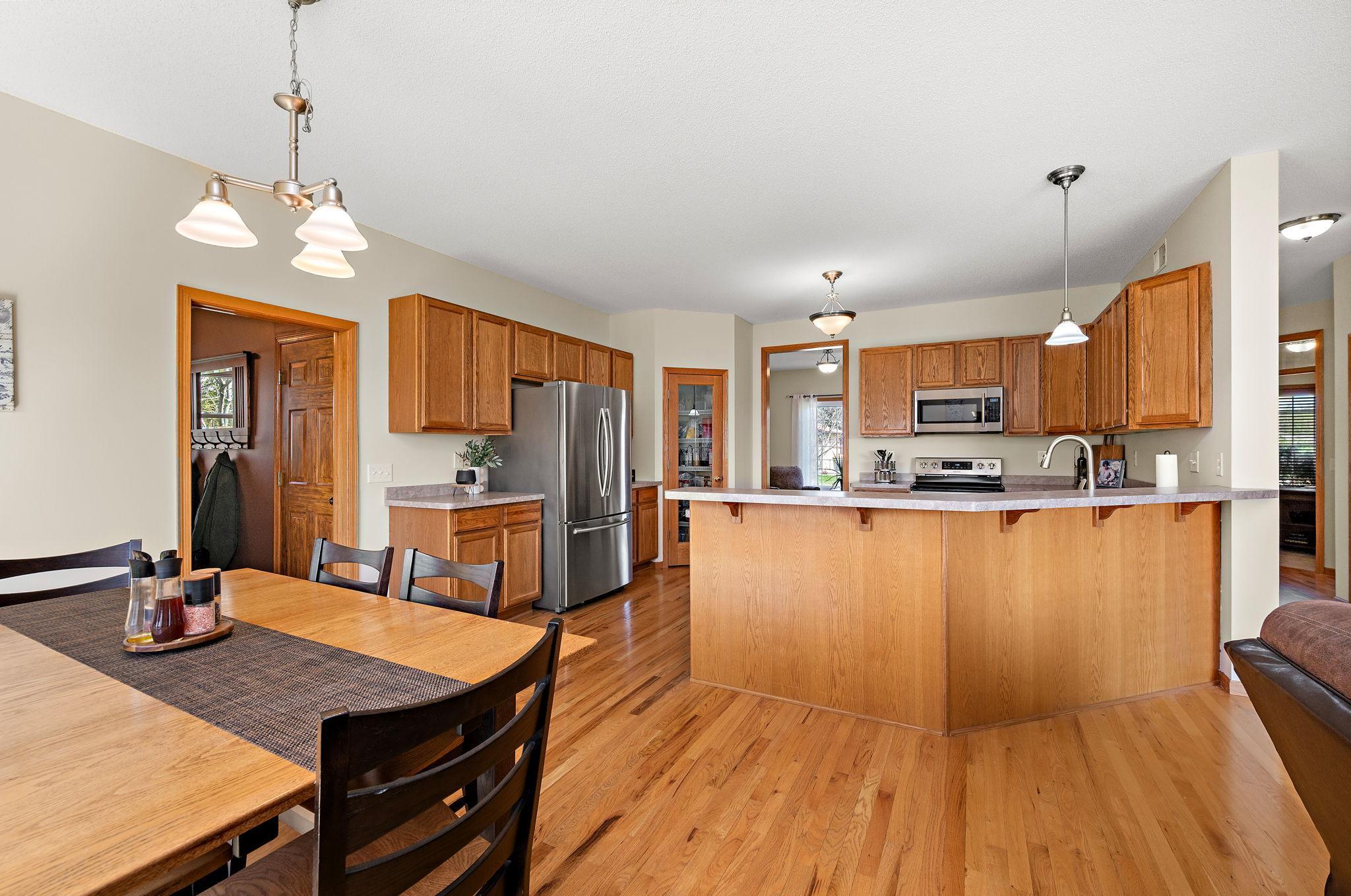 The kitchen features stainless steel appliances, a large breakfast bar and a walk-in pantry!