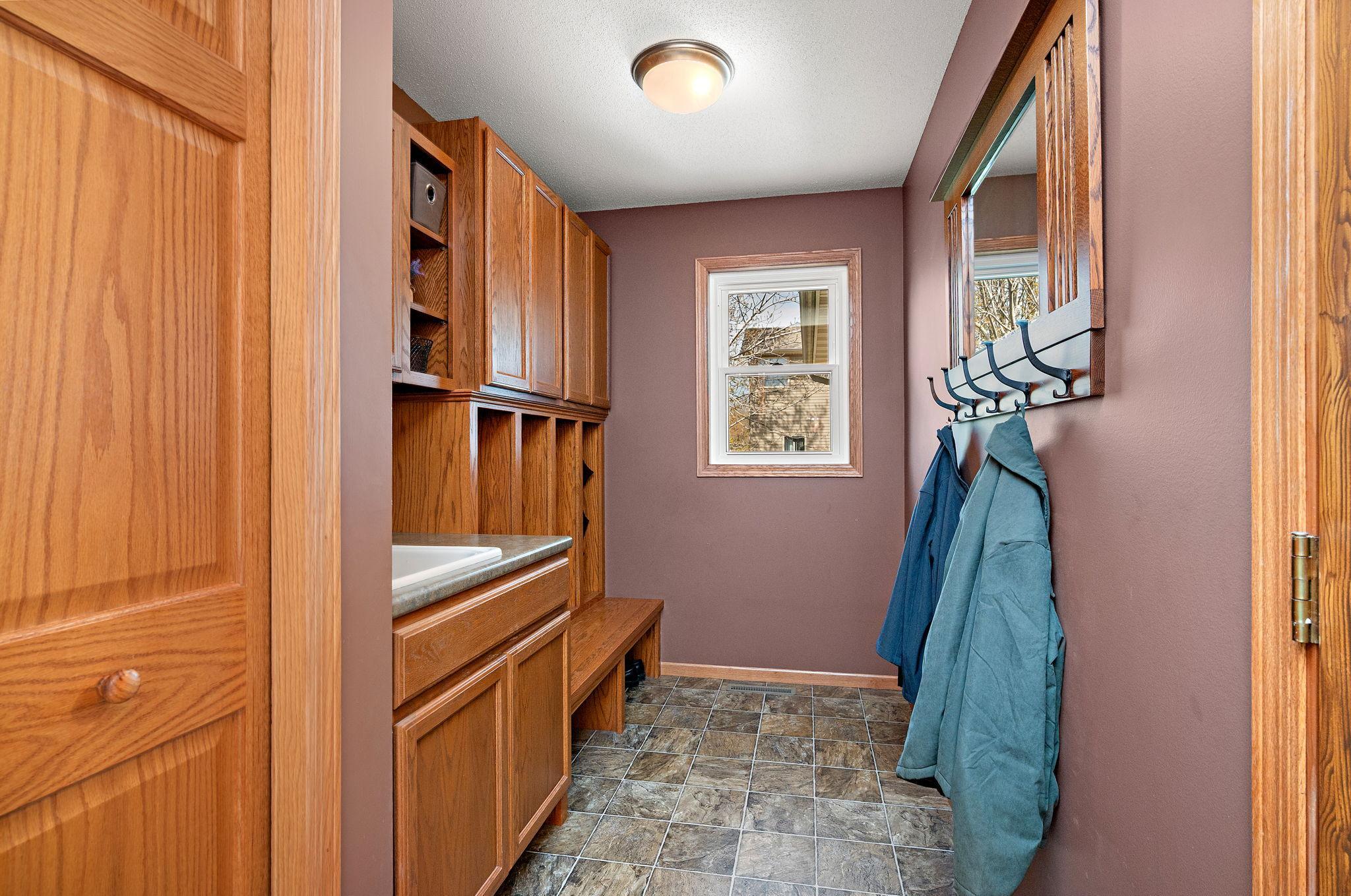 Main Floor Mud Room with lockers and utility sink