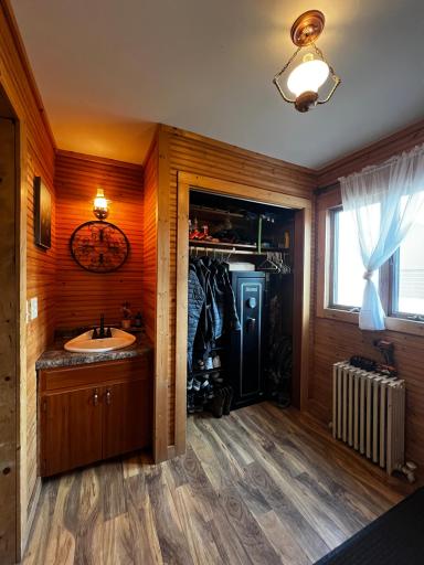 Additional entryway perfect with coat closet and a sink to wash up from working outside!