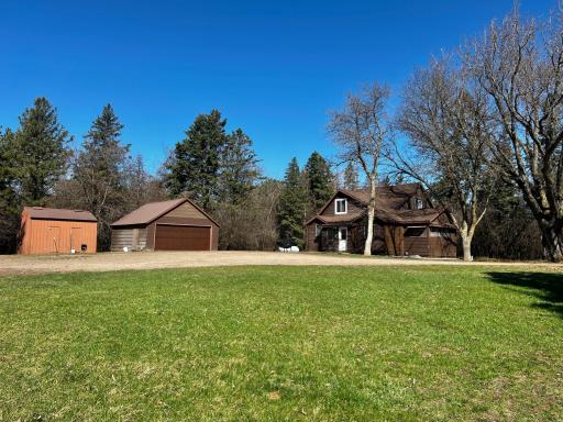 Front Yard view of Storage Shed, Garage and Home.