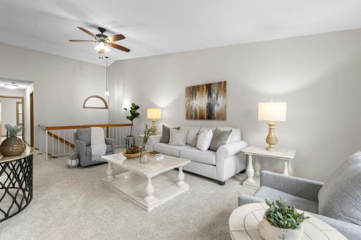 The main upper level features impressive 12-foot vaulted ceilings.