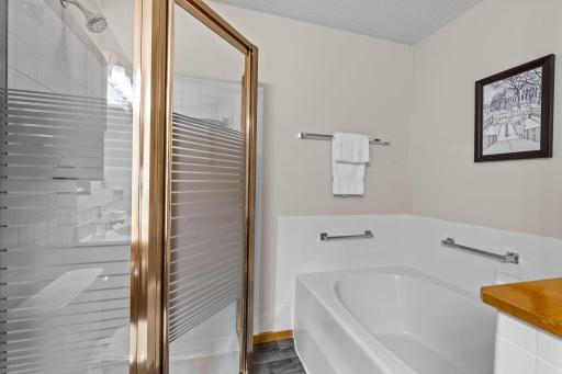 A spacious soaking tub for relaxing comfort.