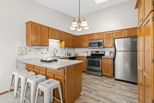 A spacious peninsula provides plenty of prep space along with additional seating.
