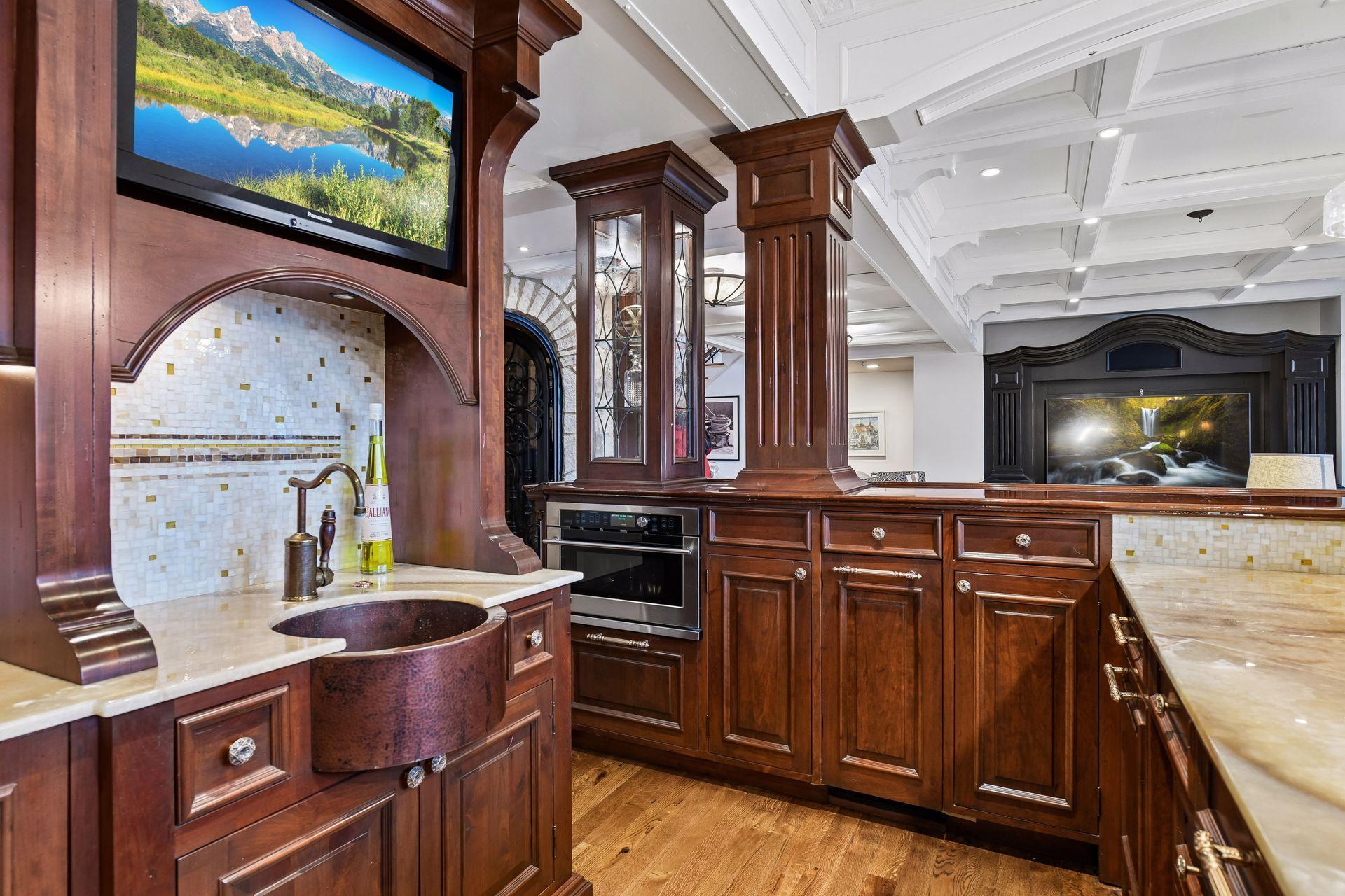 See the detail in the carved wood, and hardware, countertops, this is a rare beauty.