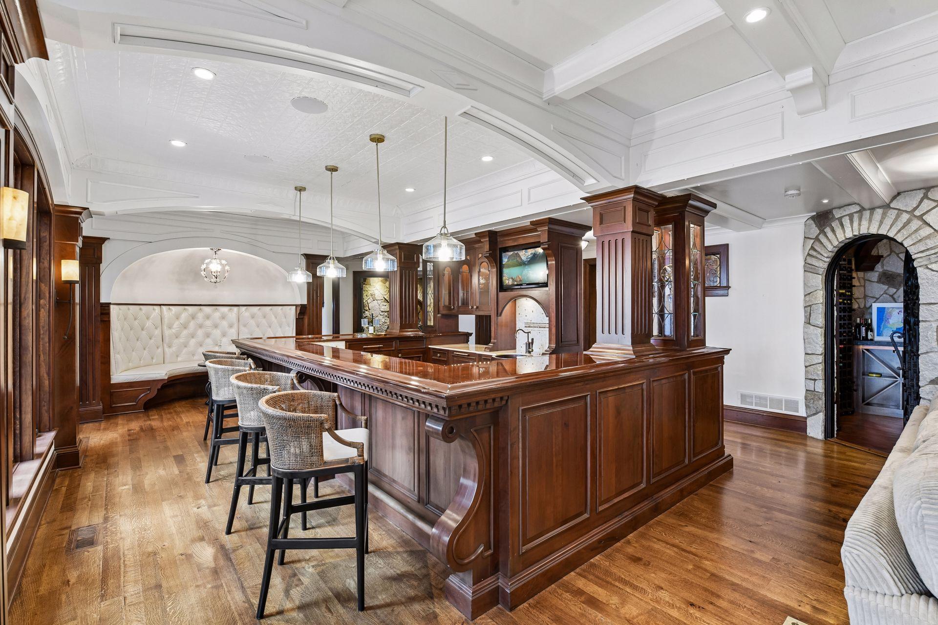 This custom bar is one for the books with a television, sink appliances and so much more. You must see to believe!