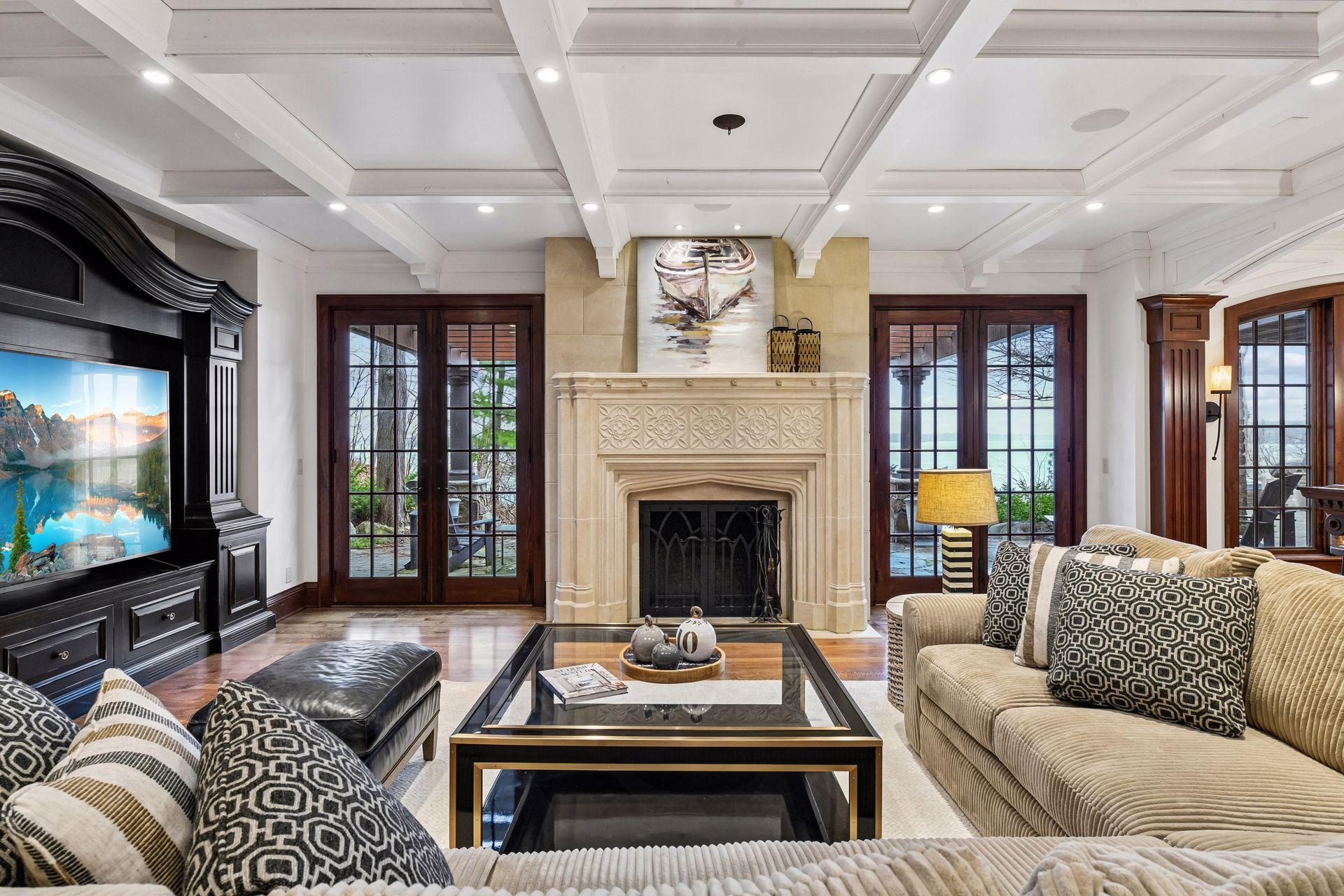 Beautifully designed family area offers more views of the lake, with a stuningly beautiful fireplace.