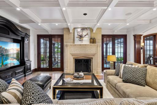 Beautifully designed family area offers more views of the lake, with a stuningly beautiful fireplace.