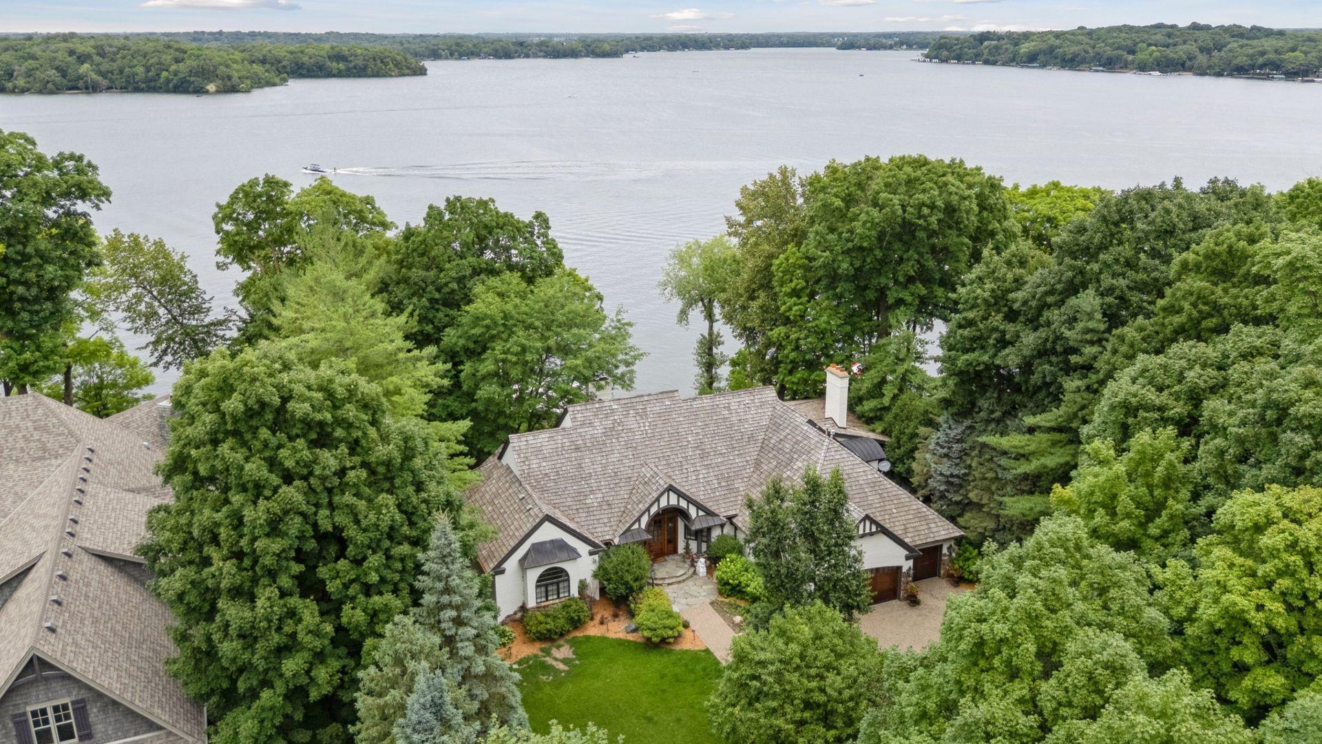 Aerial photos from above looks over this beautiful custom home with views over Smithtown Bay, on Lake Minnetonka