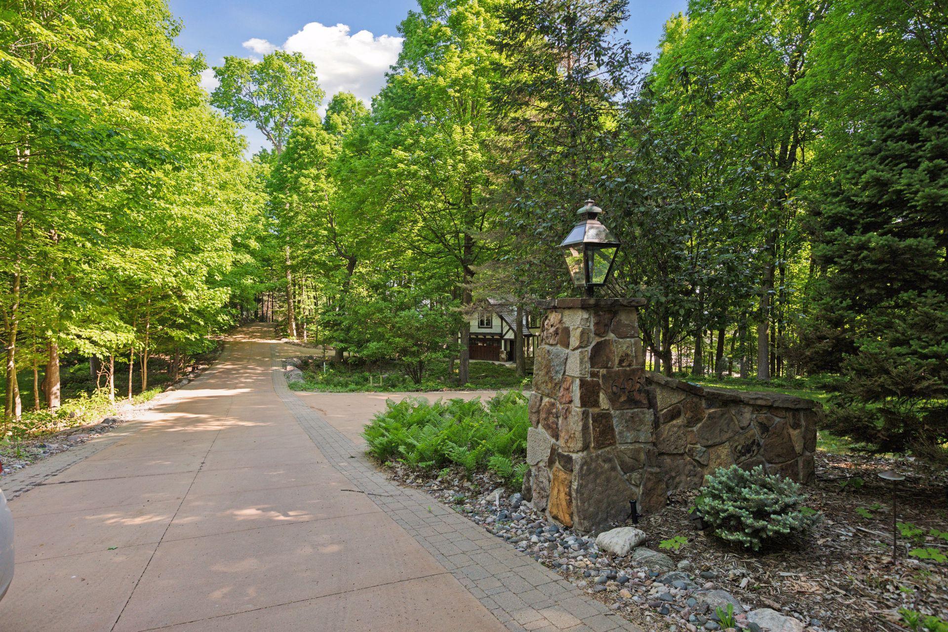 Stone pillar entrance to the Property