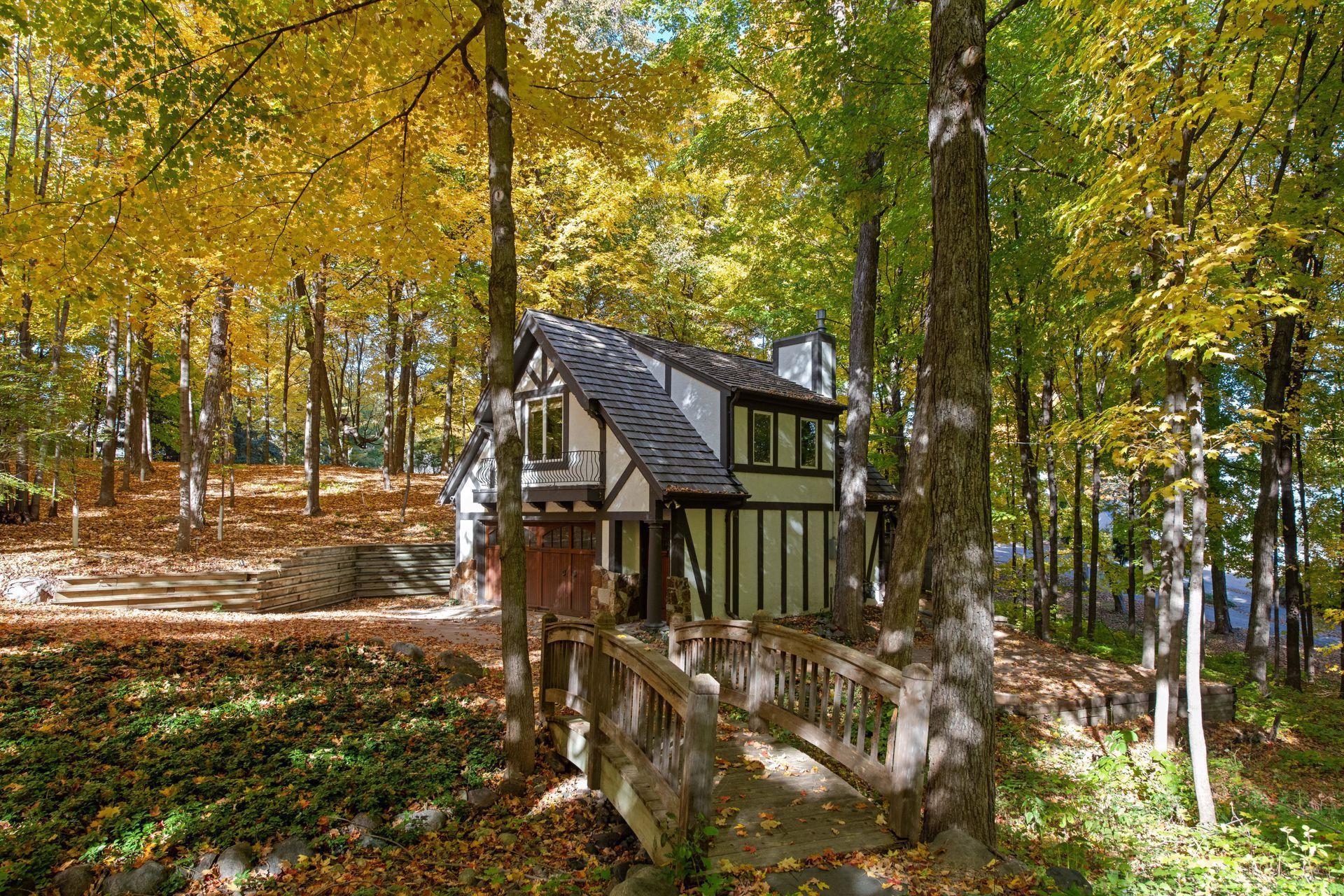 Picturesque Carriage house with Garage, Guest Room and bathroom above.