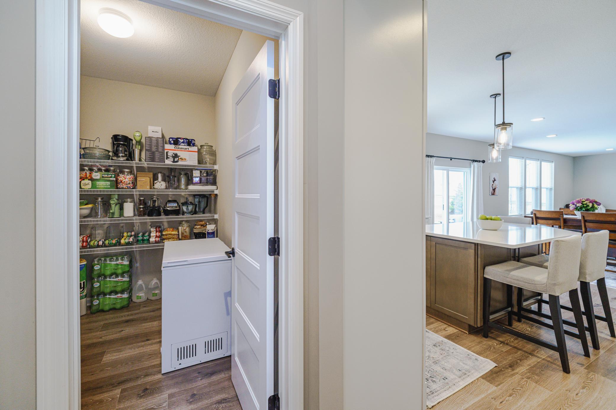 The kitchen and mud room were redesigned from the original plan to incorporate an enormous “PANTRY ROOM” for all your dry goods and kitchen overflow items.
