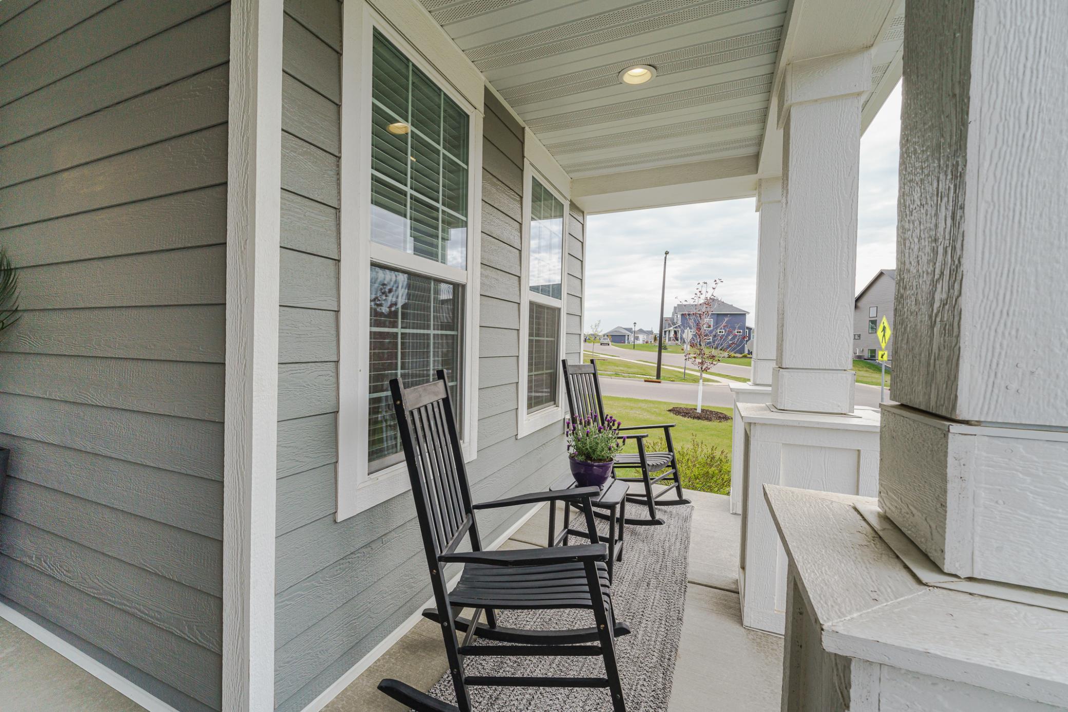 Relax on this covered front porch, where you can enjoy some shade or a rainstorm.