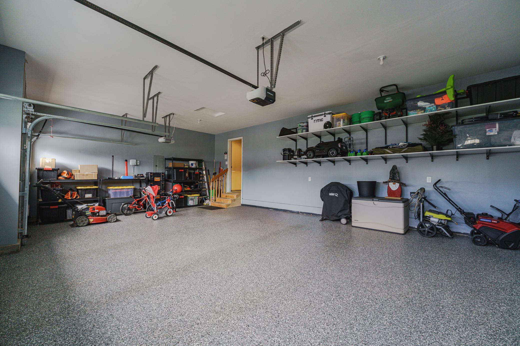 Don't forget to check out the garage, with finished and painted walls, and a NEW Polyurea garage floor by Superior Garage Floor that is easy to mop clean! Each garage door has an opener.