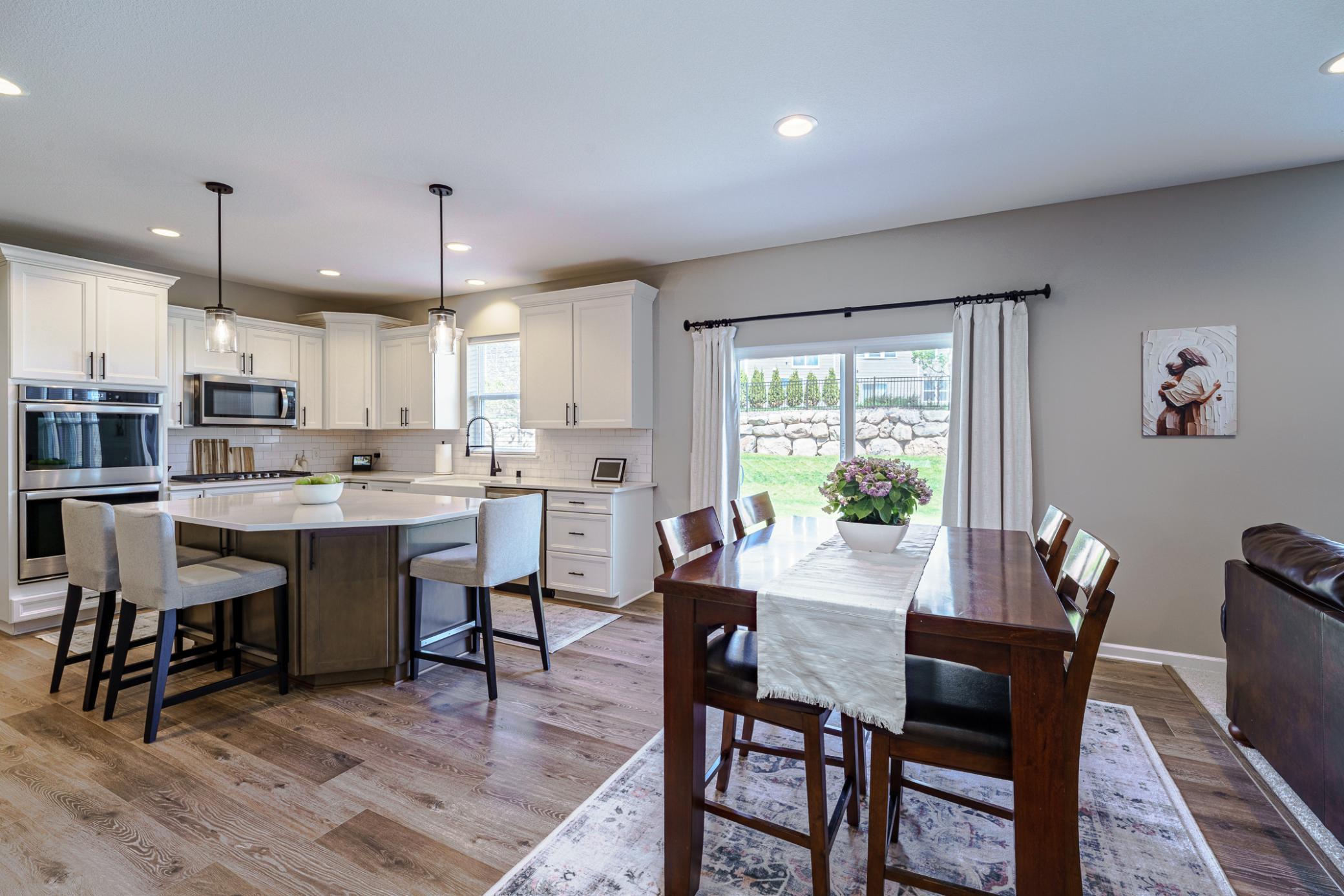 The kitchen has ample countertop space and a spacious eat-in kitchen.