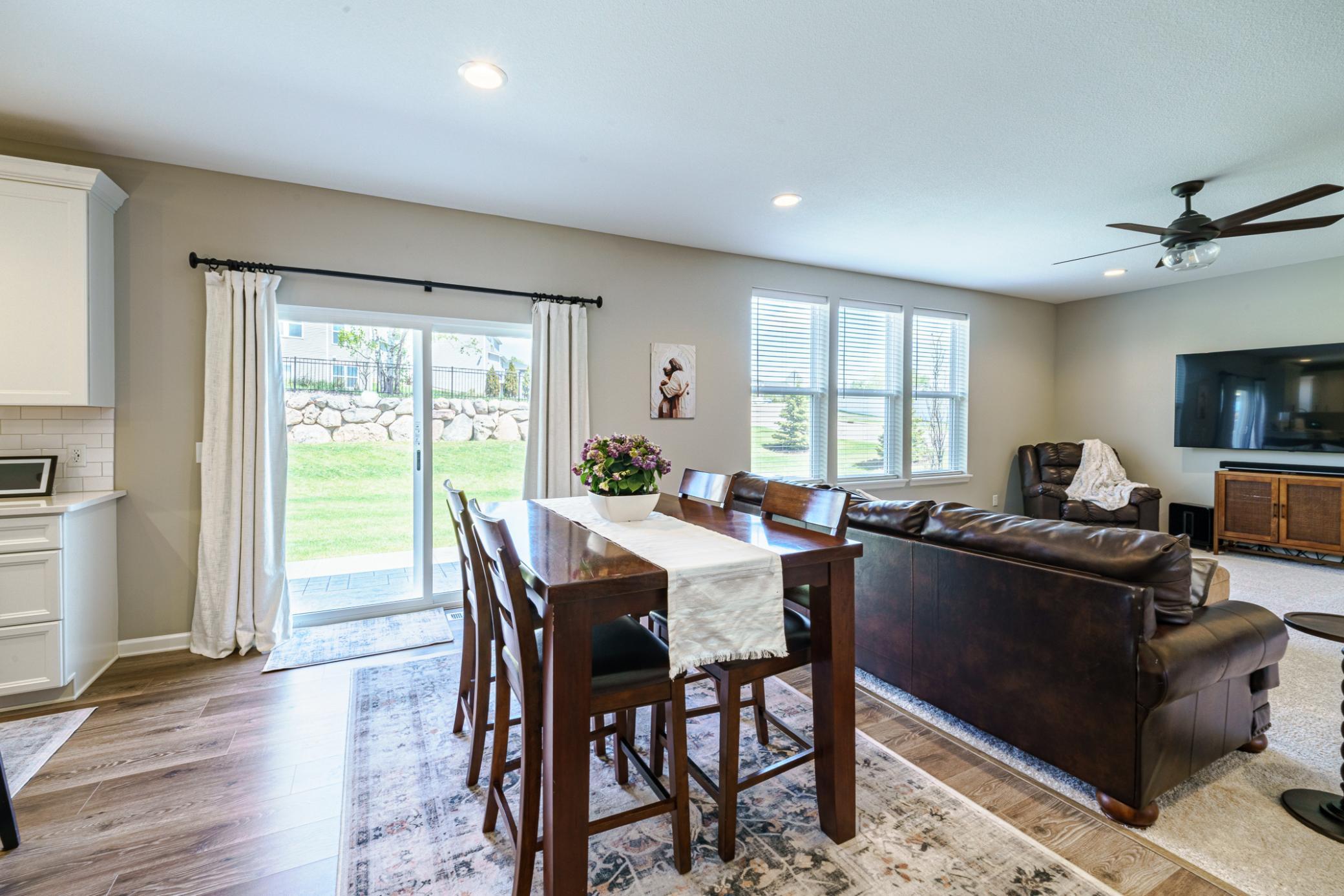 The dining area walks out to the new patio behind the home.