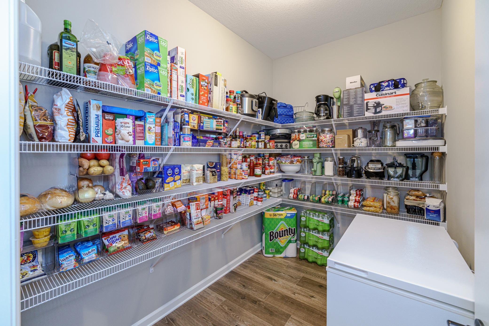 This pantry is simply enormous and can even accommodate your chest freezer! No running down to the basement for frozen goods!!