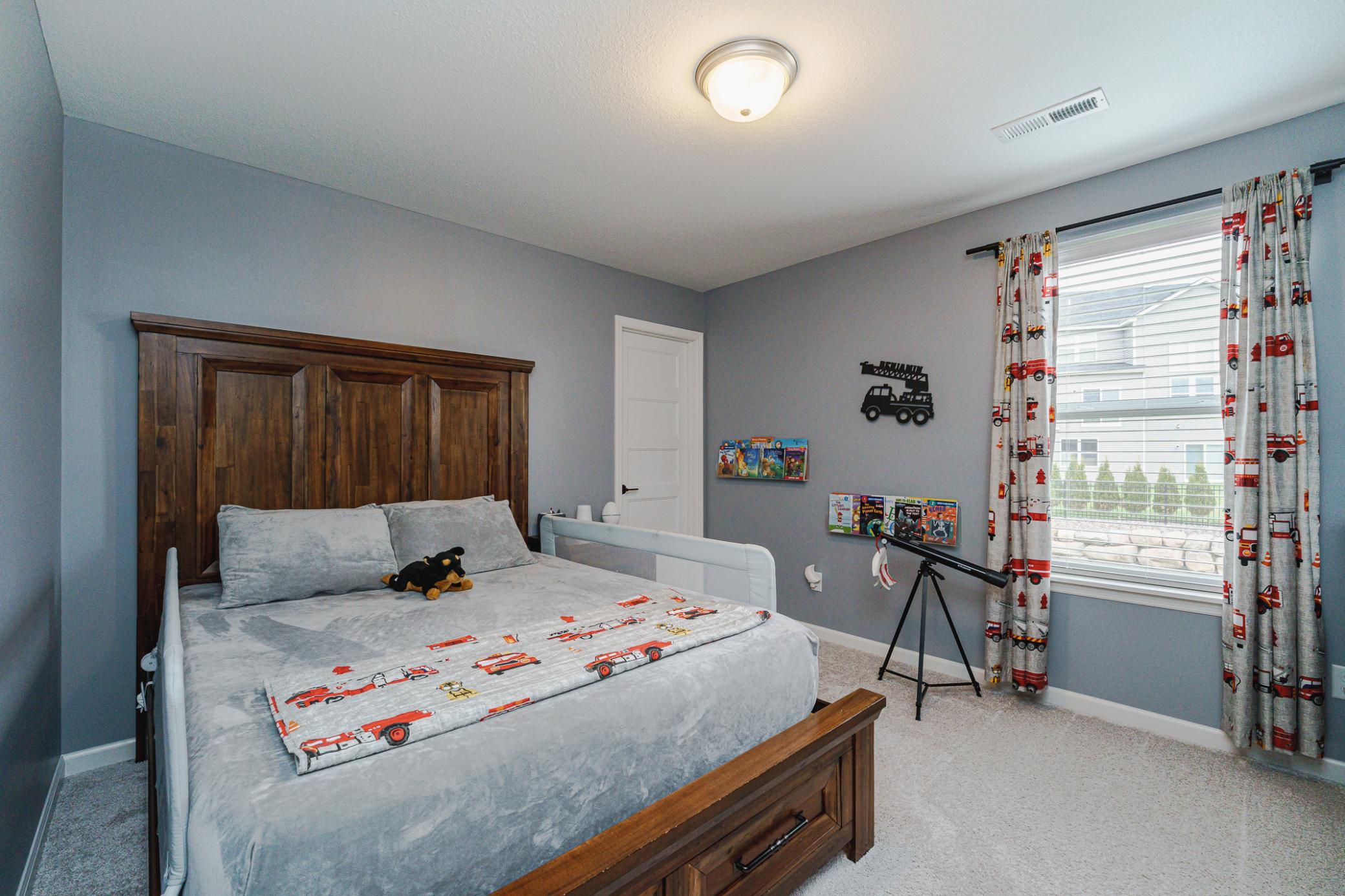 This is one of four bedrooms on the upper level. This room has BRAND NEW CUSTOM CLOSET ORGANZERS, just added in January 2026.