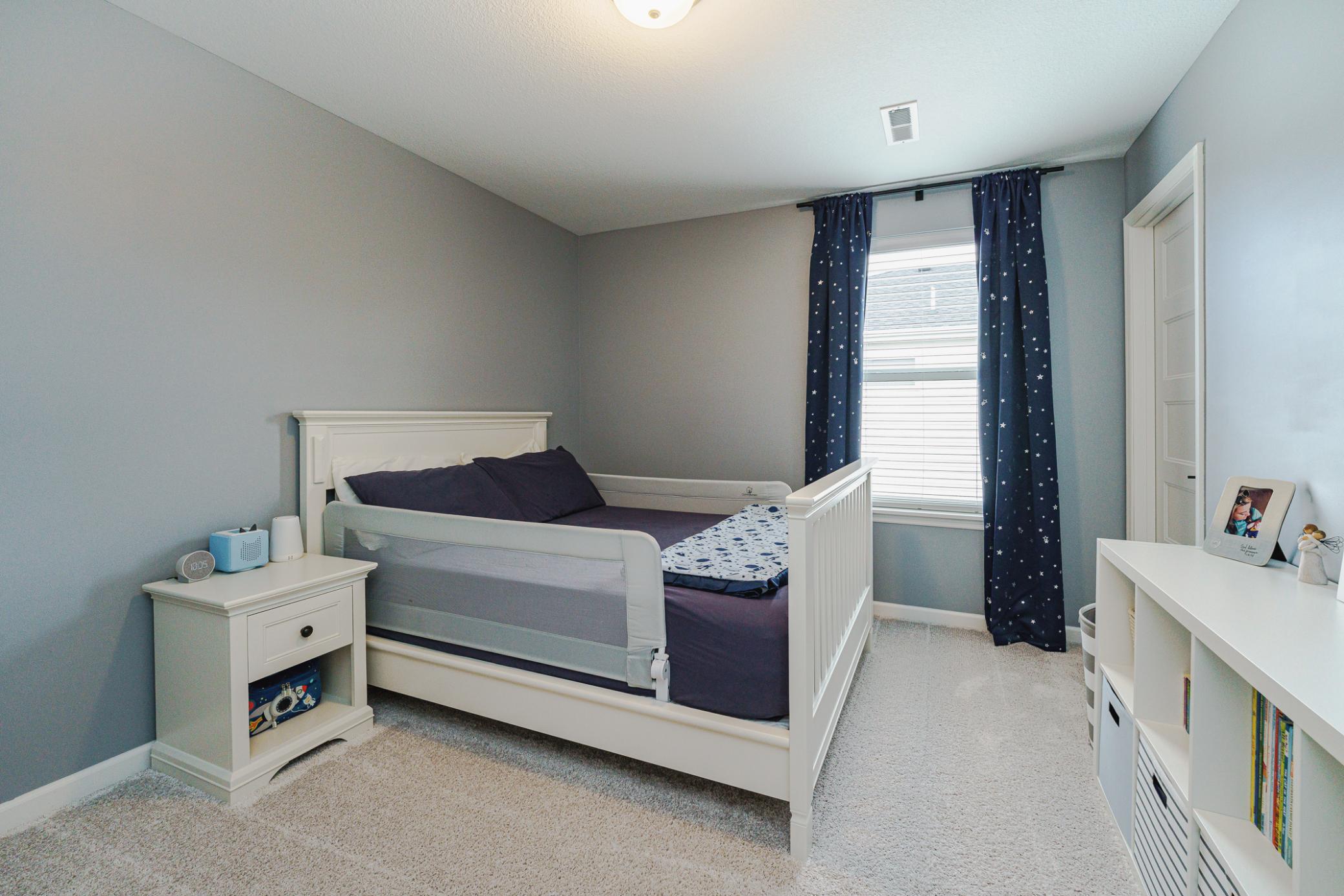 This is one of four bedrooms on the upper level. This room has BRAND NEW CUSTOM CLOSET ORGANZERS, just added in January 2026.