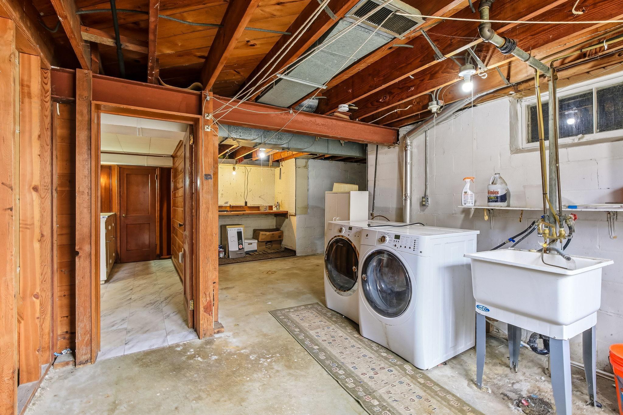 Lower level laundry room with room for workshop and hobbies....
