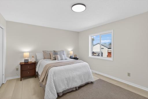 Upper level: primary bedroom with 3/4 bathroom