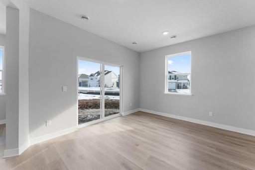 The sliding glass door allows easy access to the outdoors from the informal dining room.