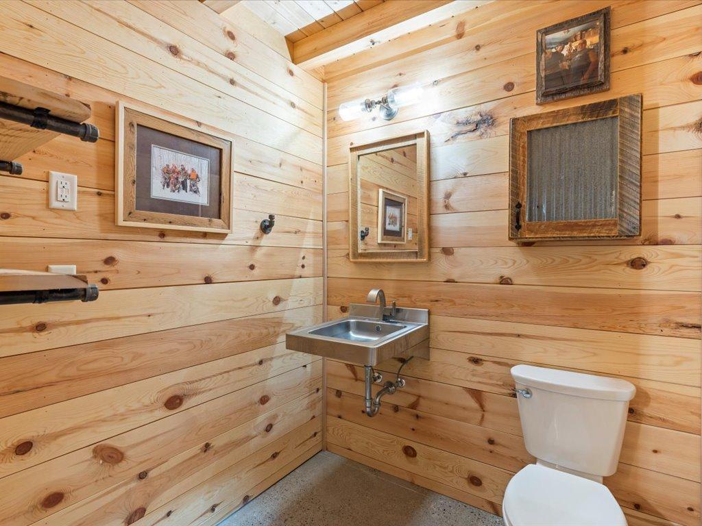 Main level 1/4 bath next to garage.