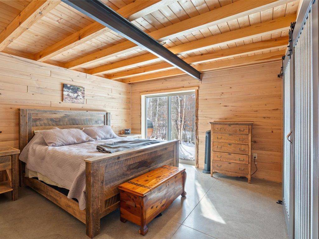 Bedroom 4 with patio to backyard.