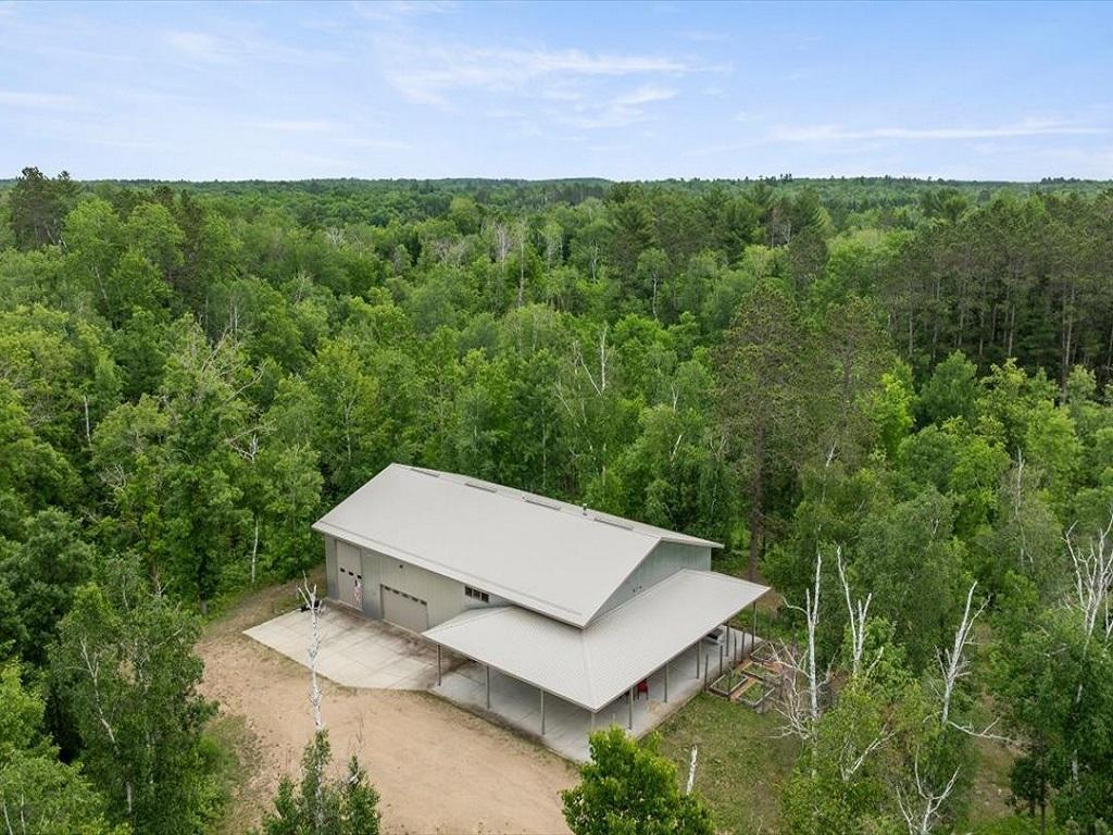 Tucked away for privacy - You will find this 4 BR, 3BA home with 1920 square foot attached garage all on 12.54 acres.
