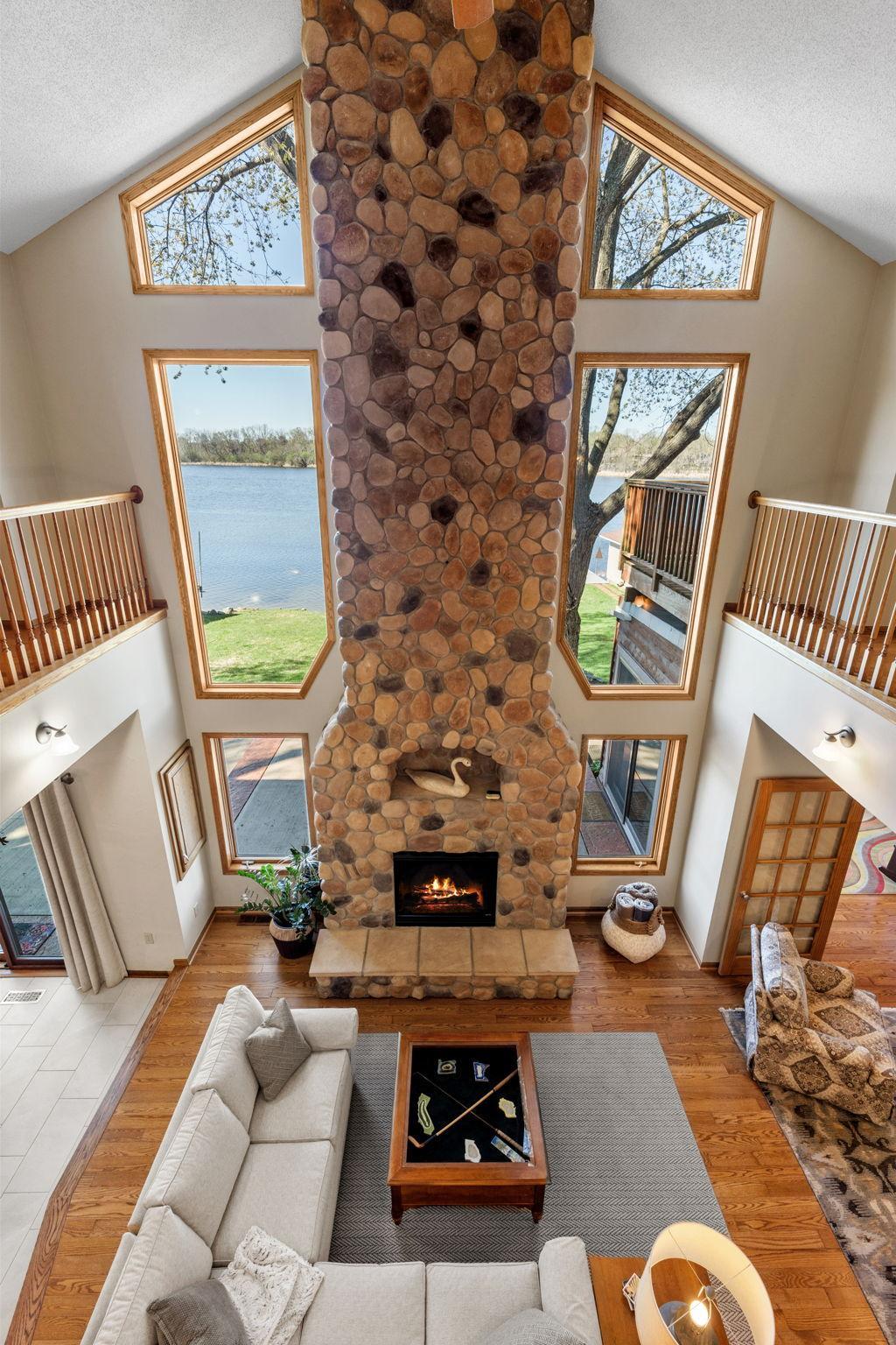 Take in beautiful lake views from the upper hallway, adding a scenic element to everyday movement through the home.