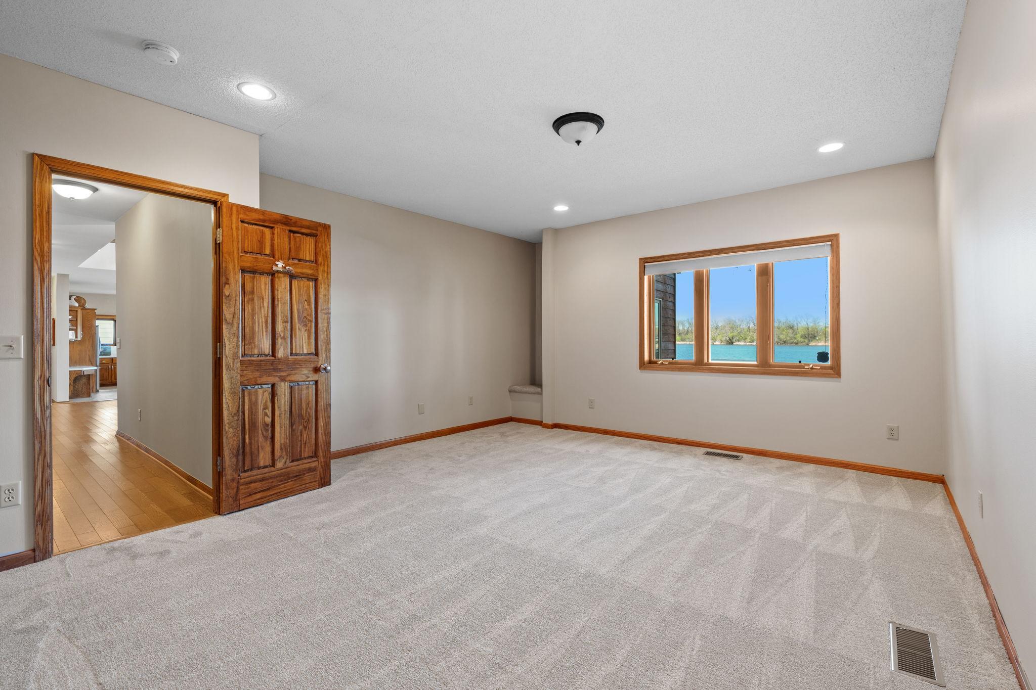 Two main-floor bedrooms provide comfortable living with natural light and closet space. These rooms offer flexibility for guests, family, or office use.
