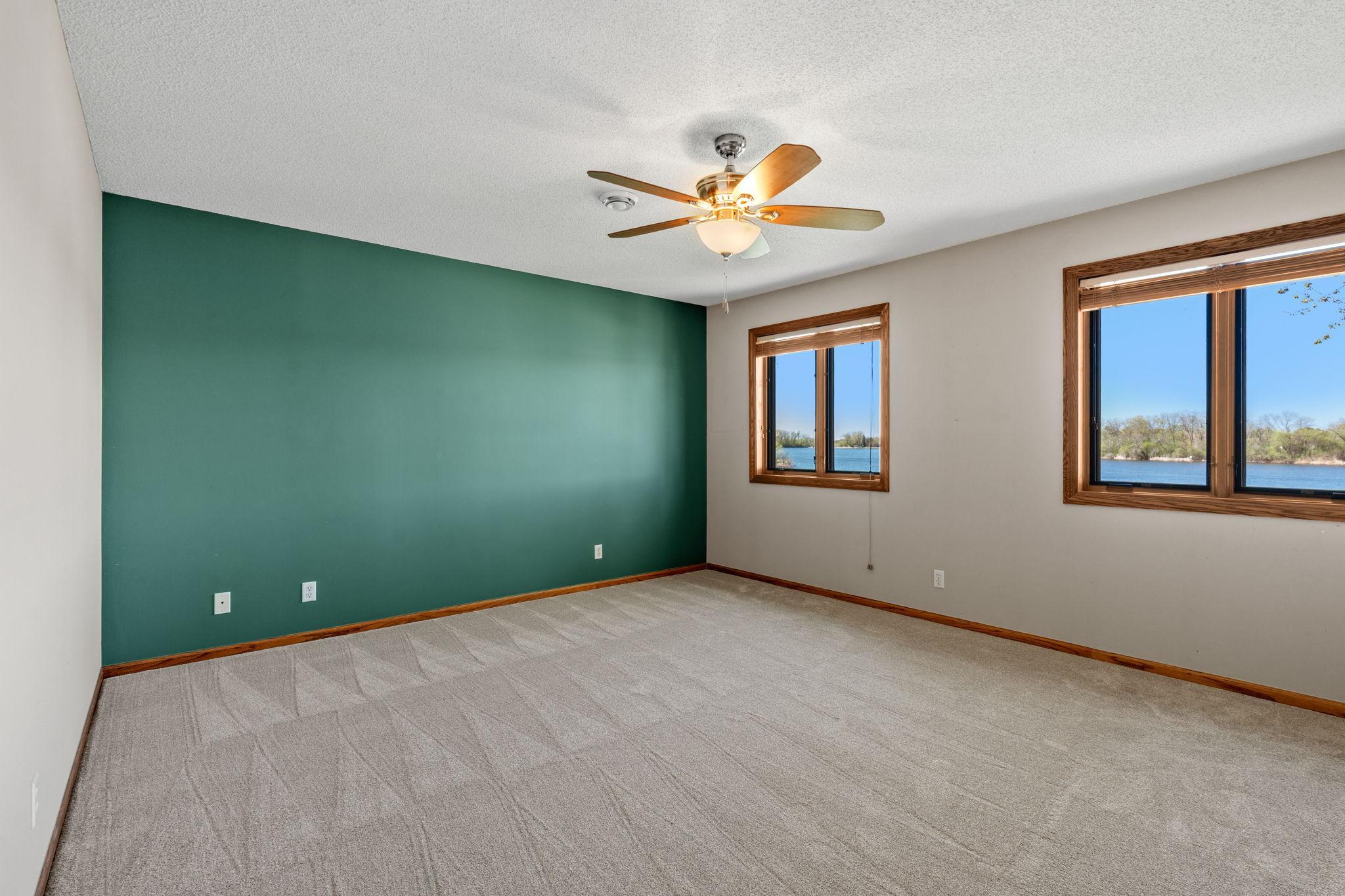 The upper level features three spacious bedrooms, each offering comfort, natural light, and ample closet space. These rooms provide flexibility for family, guests, or additional uses.
