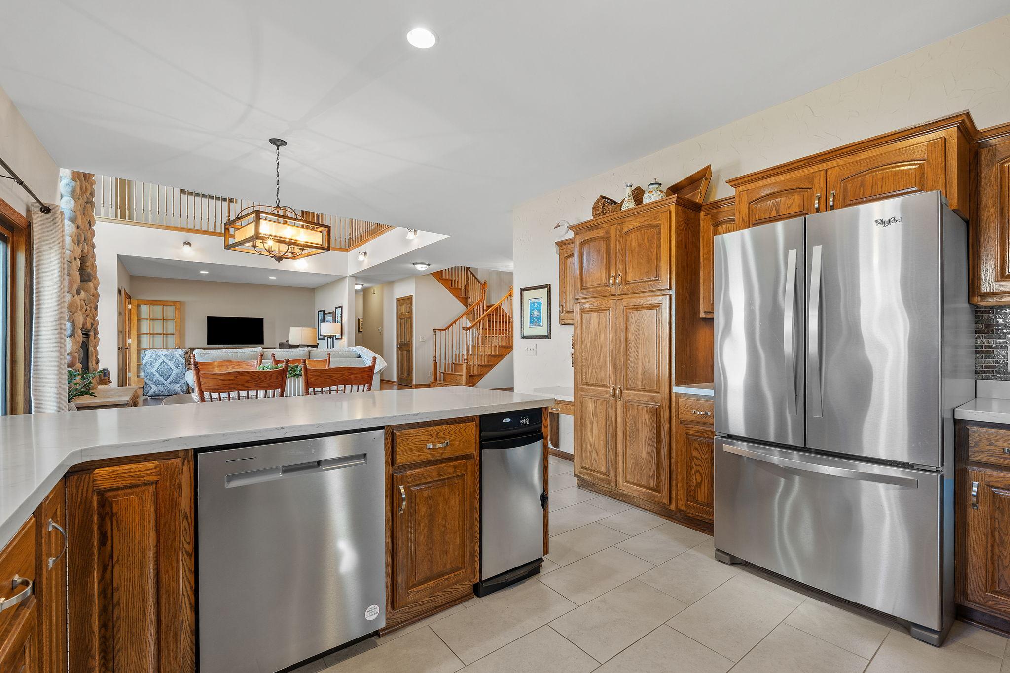 Wide countertops, stainless steel appliances, and abundant storage make this kitchen ideal for meal prep and entertaining. The breakfast bar adds extra versatility.