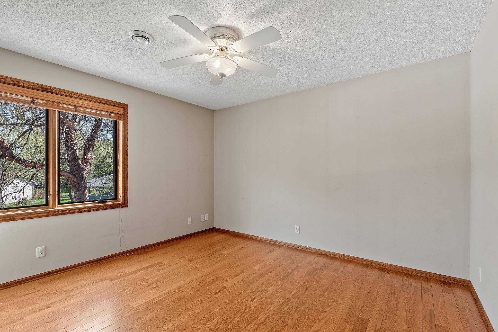 The upper level features three spacious bedrooms, each offering comfort, natural light, and ample closet space. These rooms provide flexibility for family, guests, or additional uses.