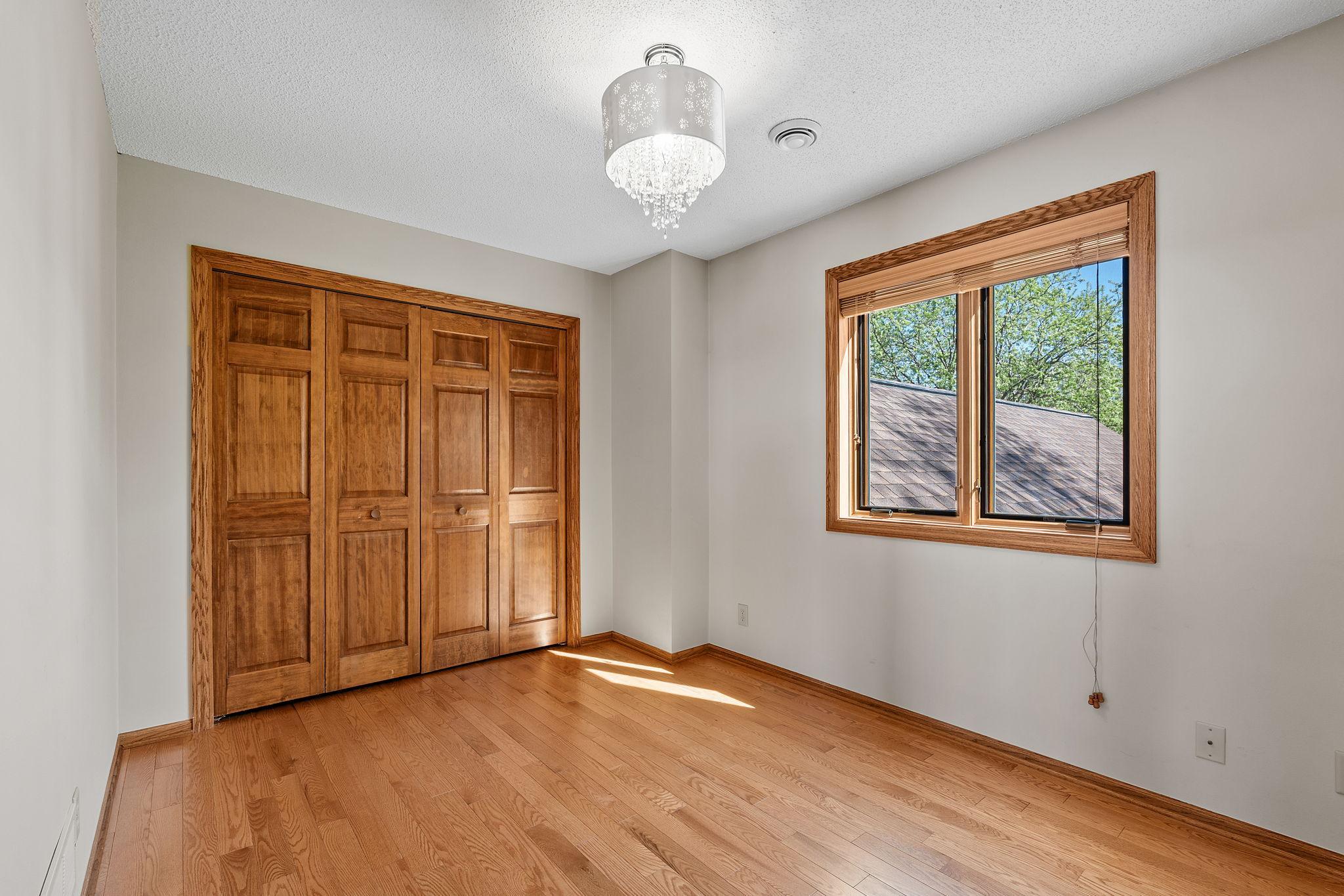 The upper level features three spacious bedrooms, each offering comfort, natural light, and ample closet space. These rooms provide flexibility for family, guests, or additional uses.