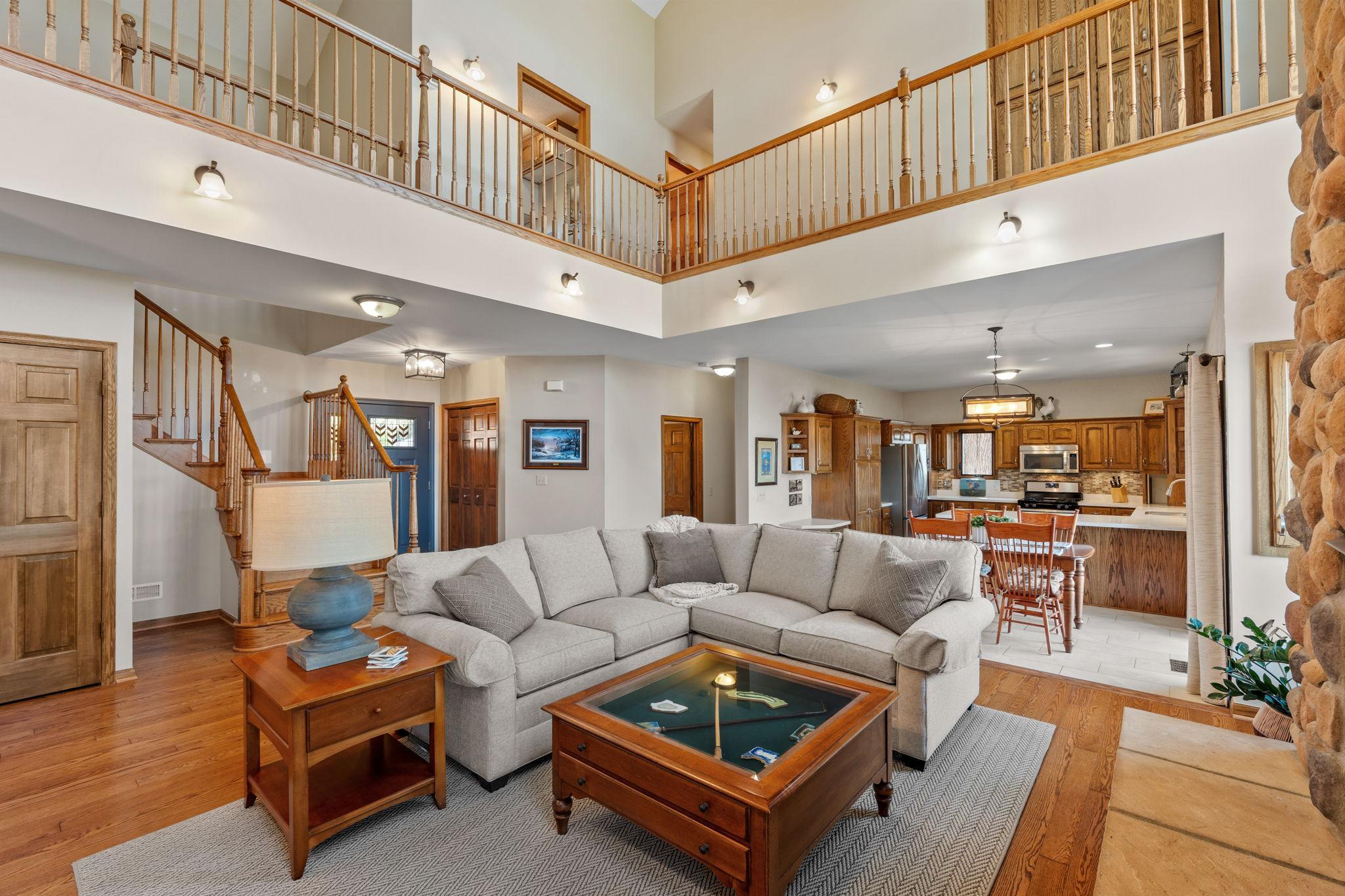 The great room flows seamlessly into the dining and kitchen areas, creating an open-concept layout ideal for modern living. It’s a space designed for both comfort and connection.