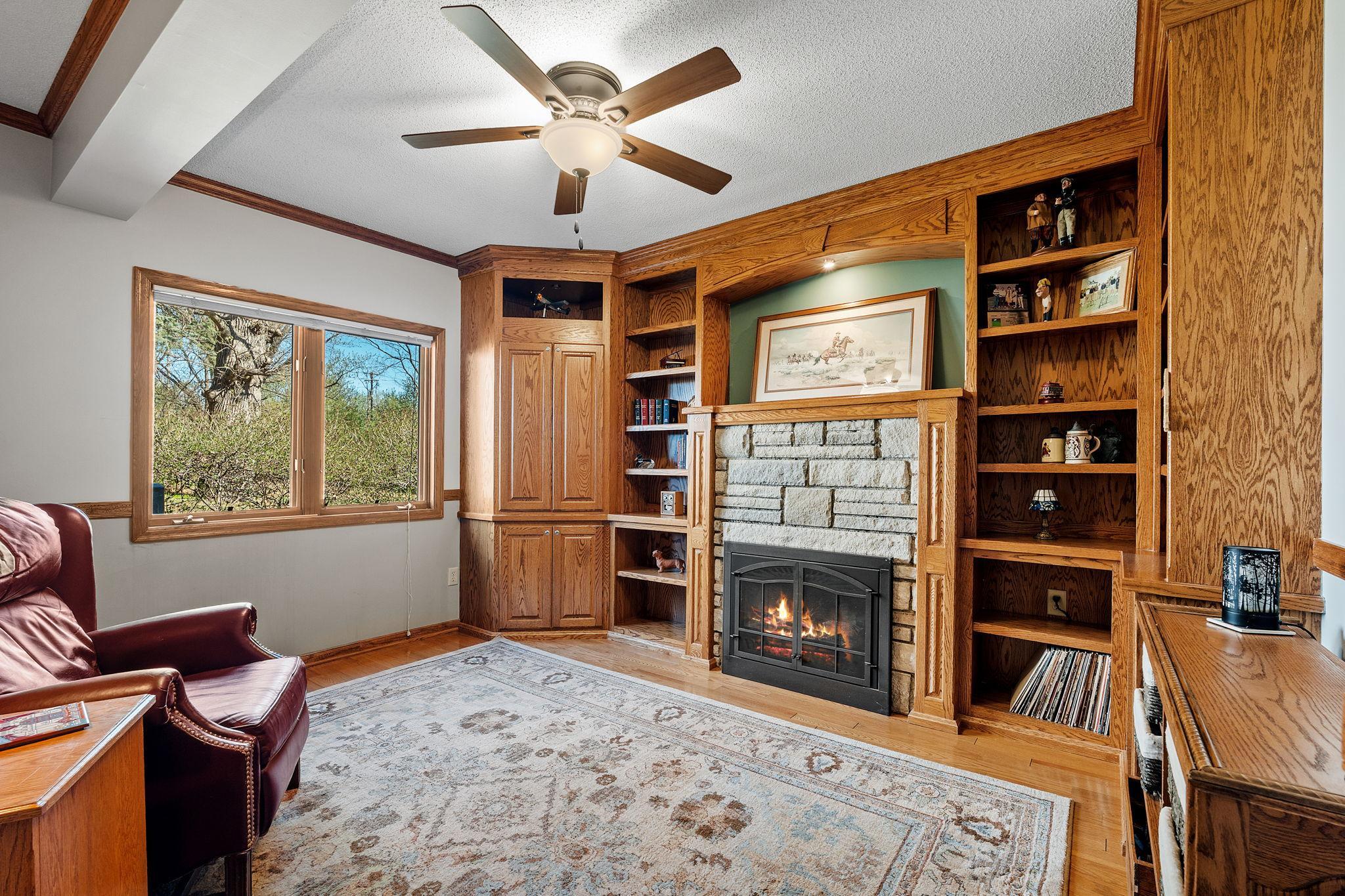 The main-floor office features its own fireplace, creating a cozy and productive workspace. It’s perfect for working from home in comfort.