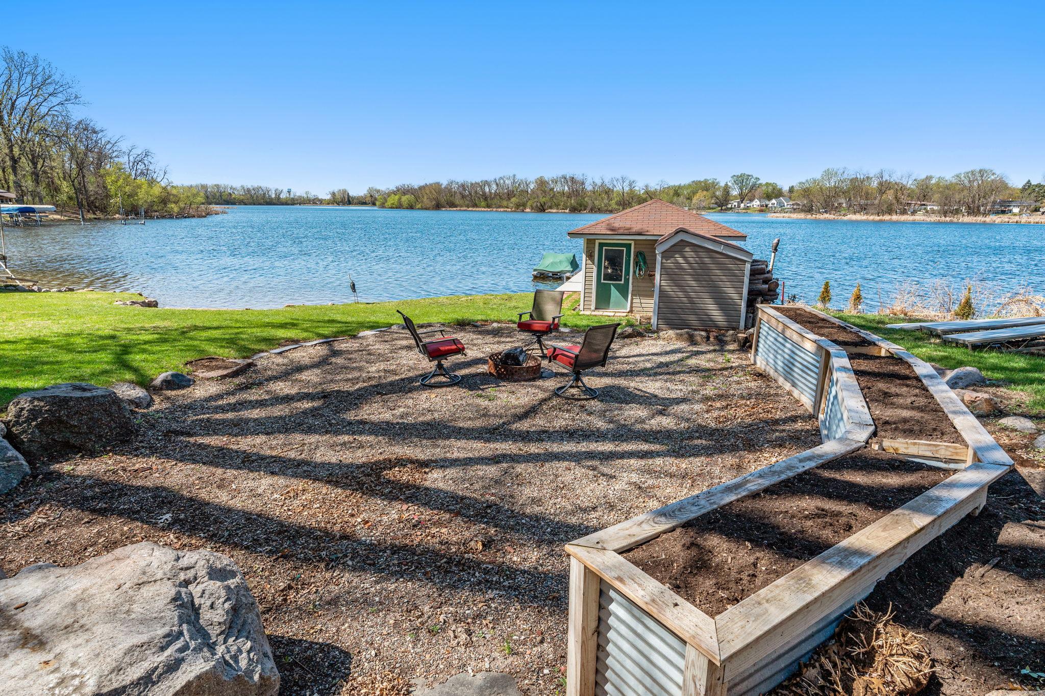 Near the boathouse and dock, a seating area offers another great space for relaxing or entertaining with lake views.