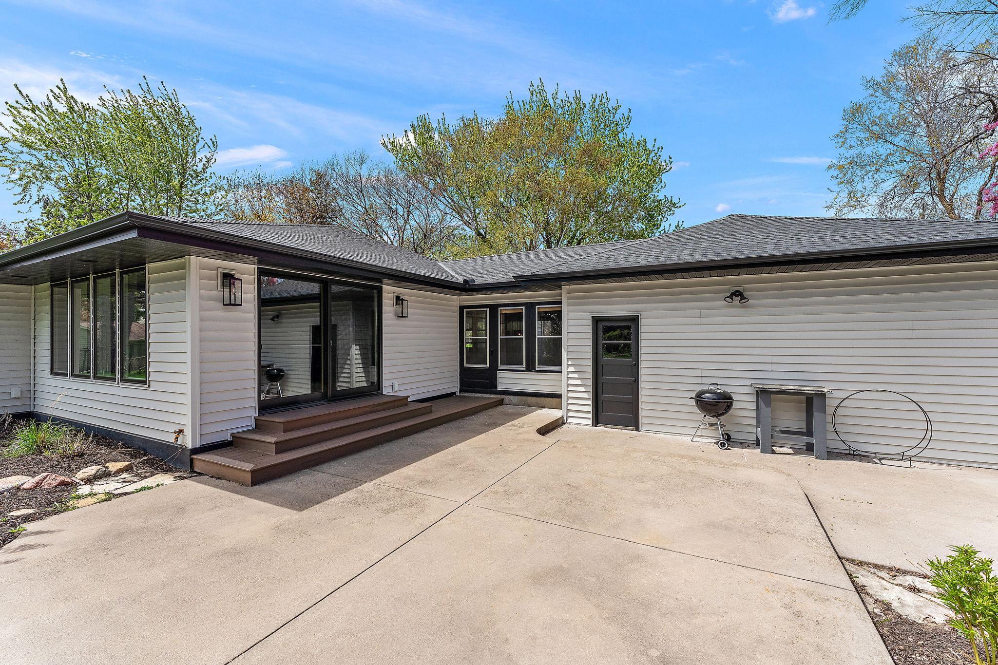 The two level rear patio walks out from the kitchen/dining area.