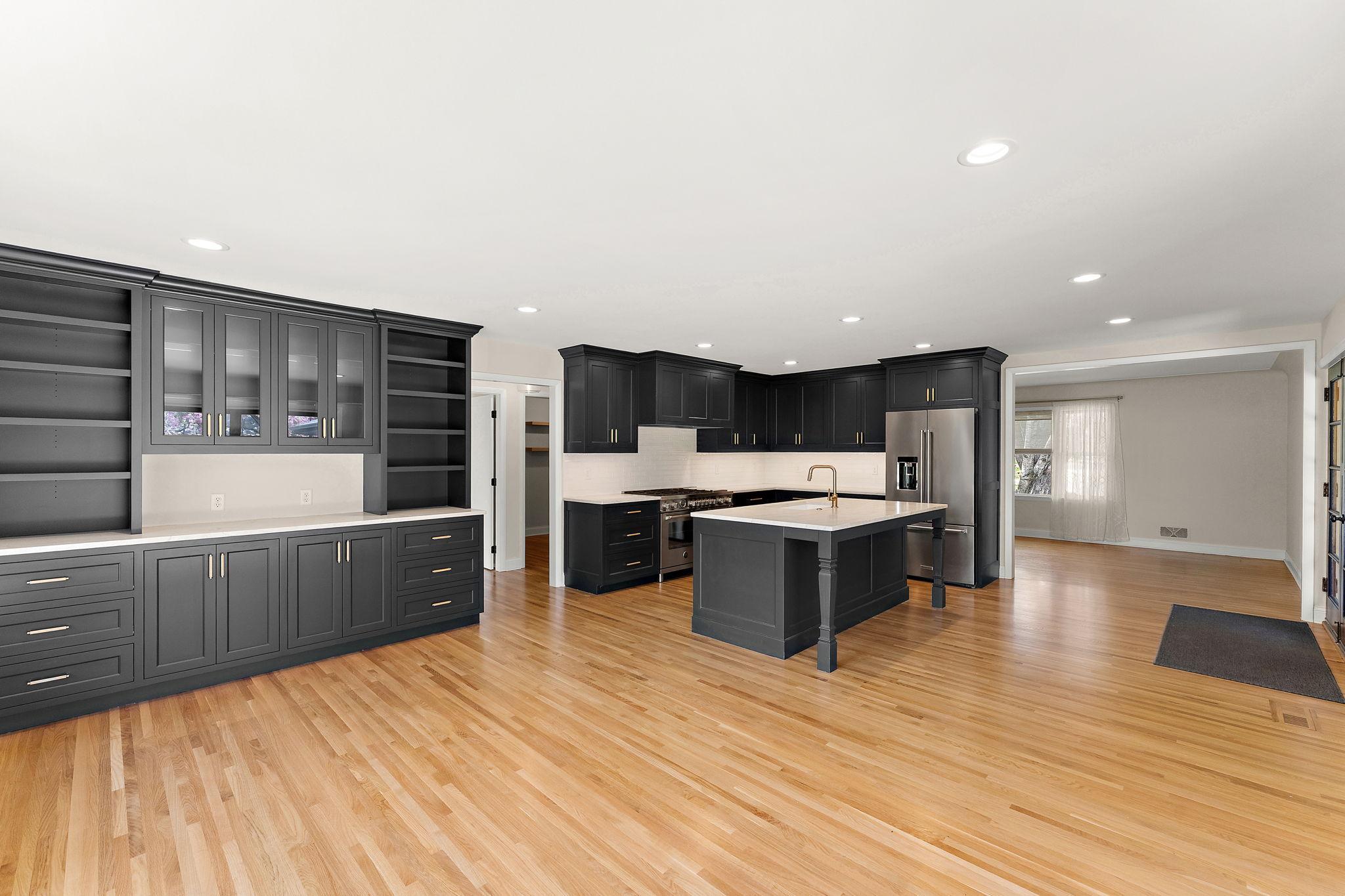 A view from the dining area through to the living room. So much custom cabinetry- storage for everything!