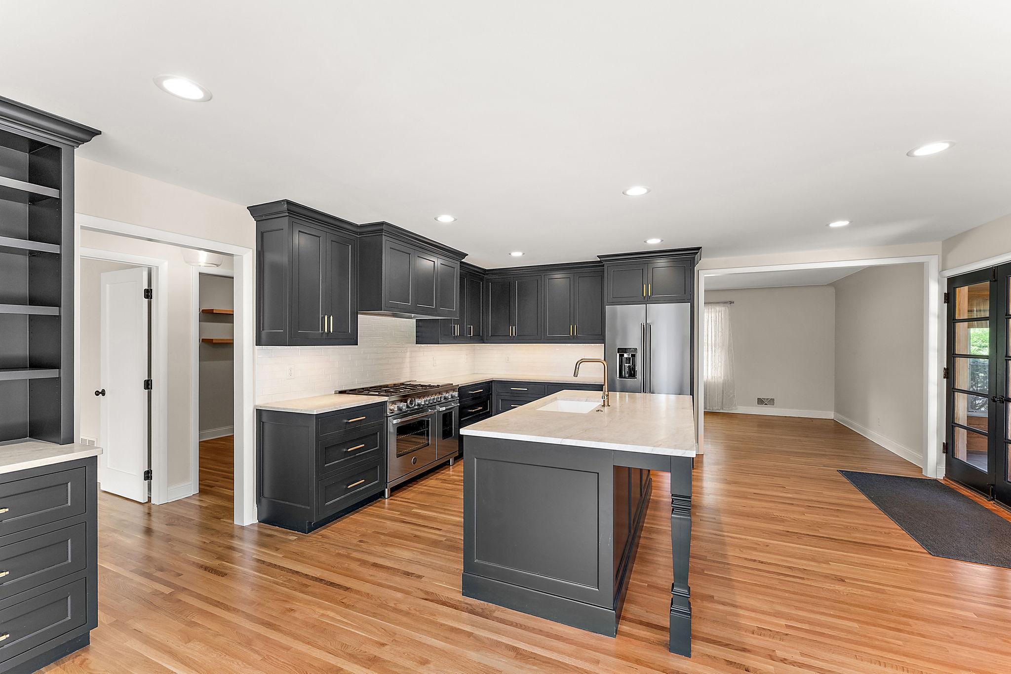 This is your dream kitchen- It flows into the living room with French doors to the Sunroom, allowing for so much natural light.