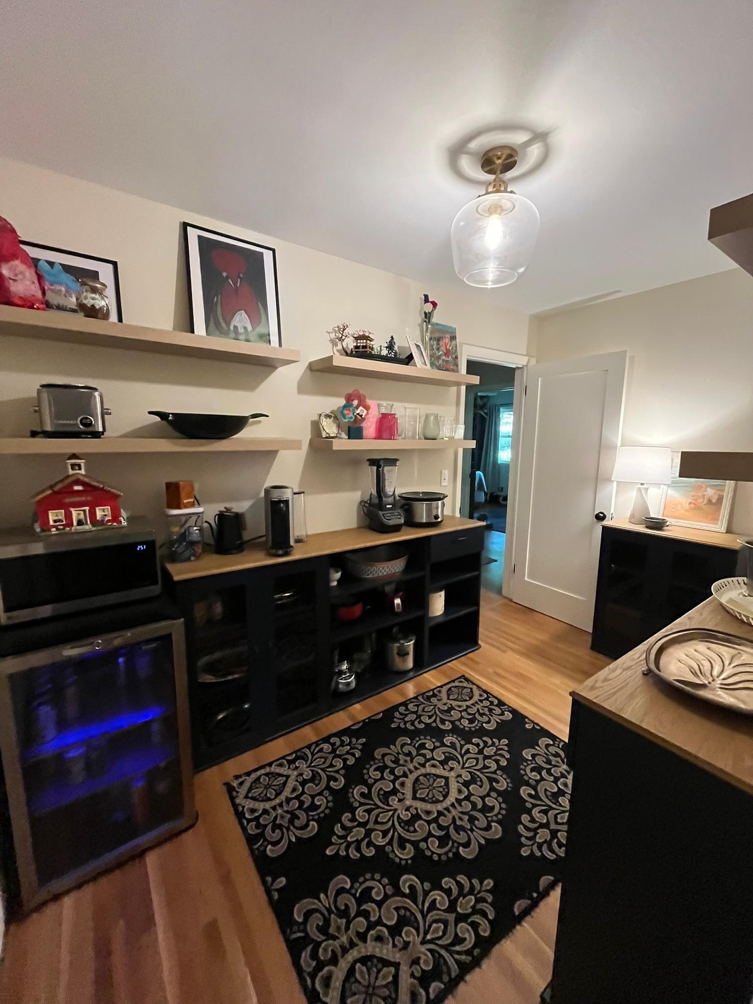 The owners used the annex room as a pantry with an extra beverage fridge.