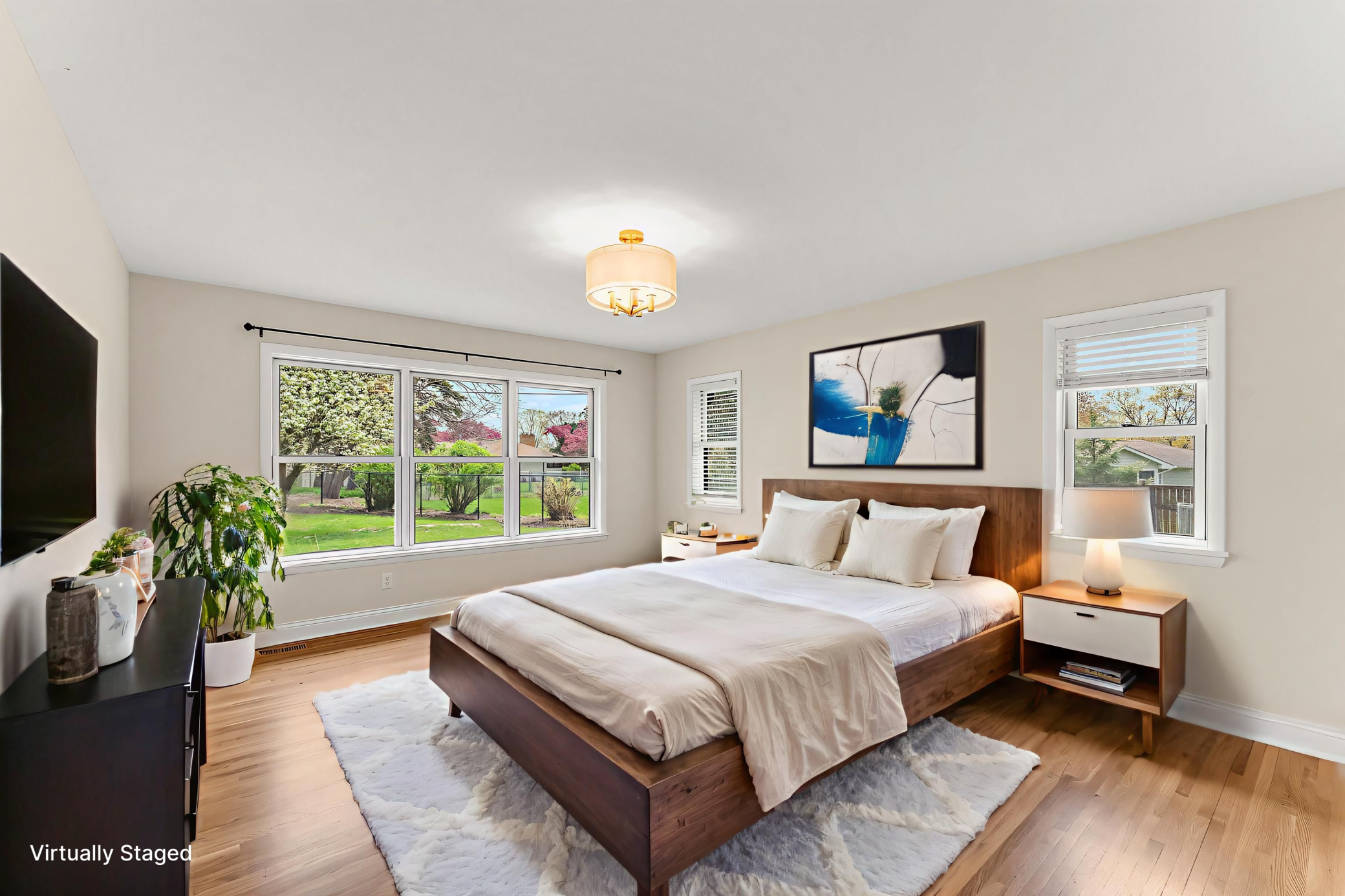 Primary bedroom-this room has East & Southern views of the back yard. You will find a large closet and a private primary bath as well.