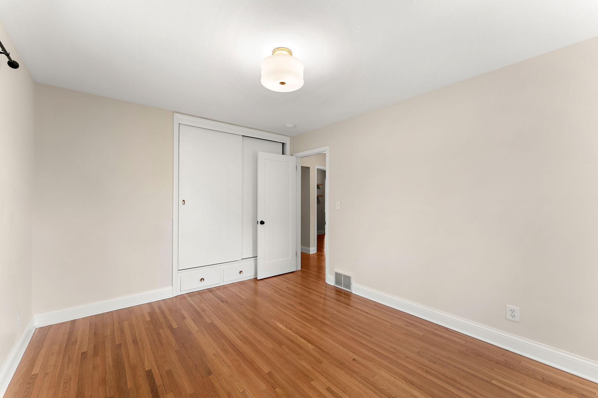 Secondary view of the third bedroom unstaged.