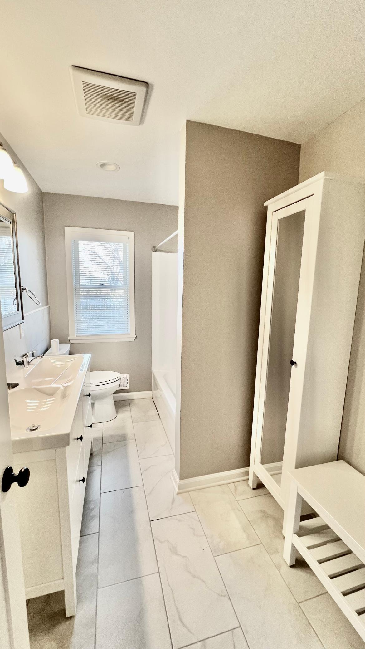 Beautiful ceramic tile flooring in the remodelled bathroom.