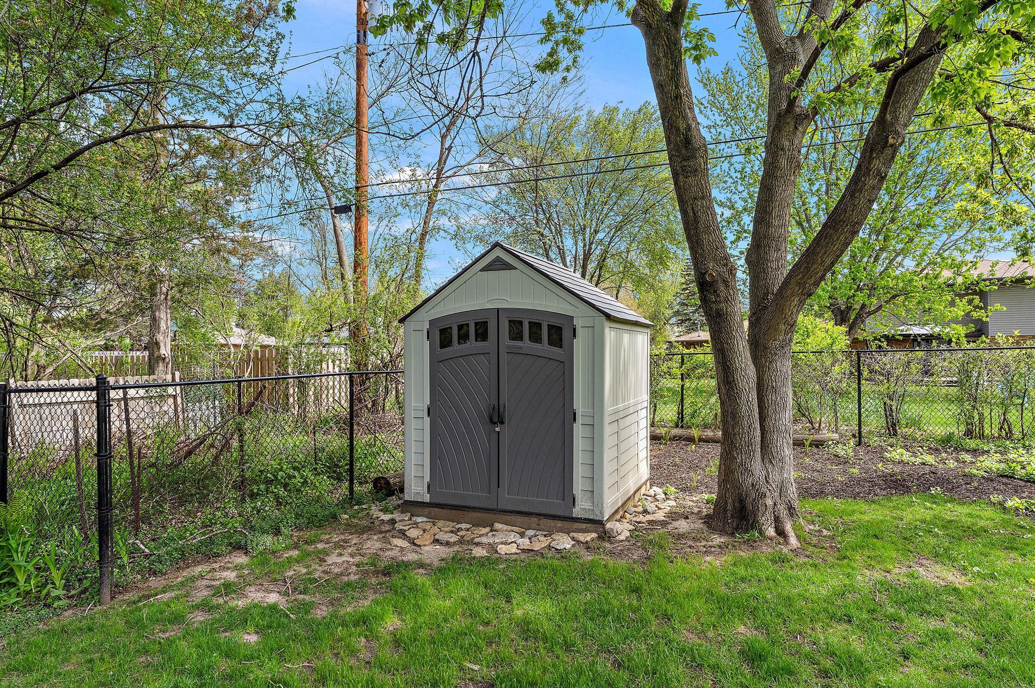 There is a garden shed for the lawn mower & tools to keep the garage clean.
