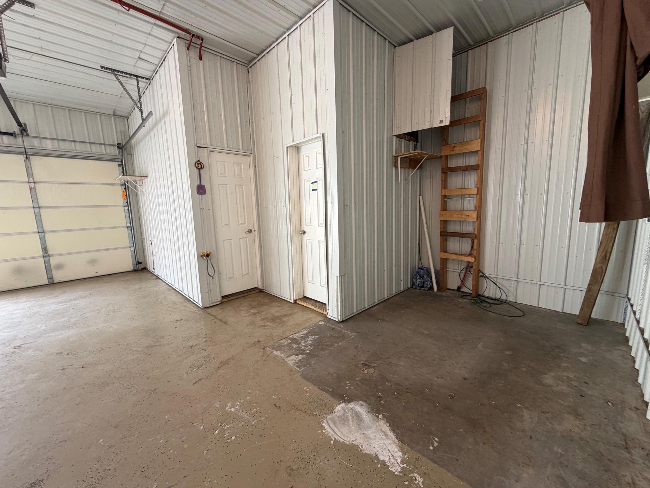 Interior of garage - Half Bath and separate door for potential office