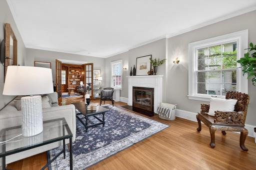 Expansive and light filled living room with gas fireplace.